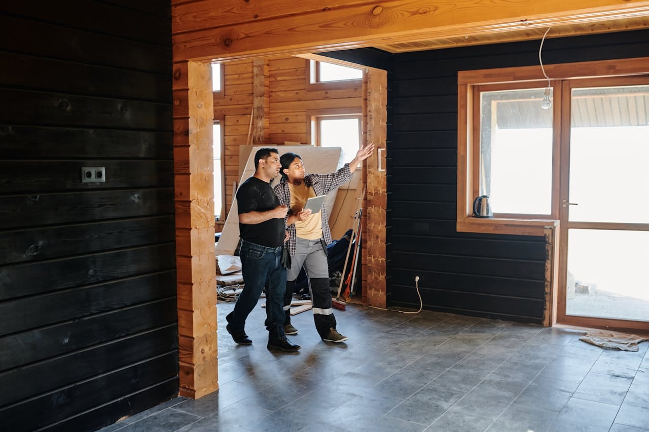 Recently completed residential remodel — open living space with warm wood ceiling and modern finishes.